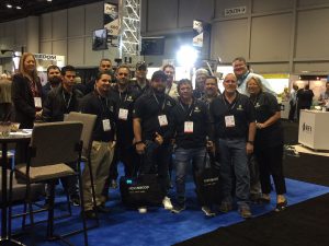 Group of Aluma employees in matching black shirts at the #IWCE2018 in Las Vegas