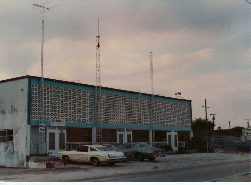 Building with three aluminum Aluma towers attached