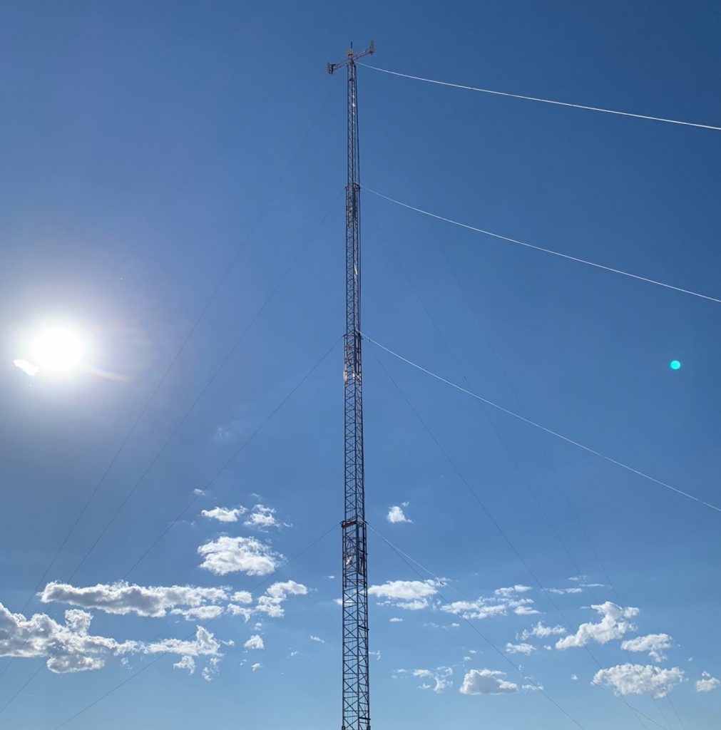 Aluma guyed aluminum telescoping mast with wires shown up in the sky